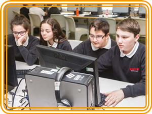 four pupils working on computers
